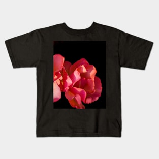 Red roses against black background Kids T-Shirt